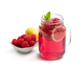 Homemade lemonade with raspberry and lemon isolated on white