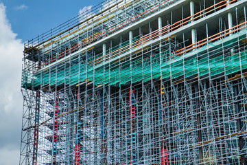 Construction of a high-rise building. Constructions. Abstract Scaffold Texture Background. Architecture.