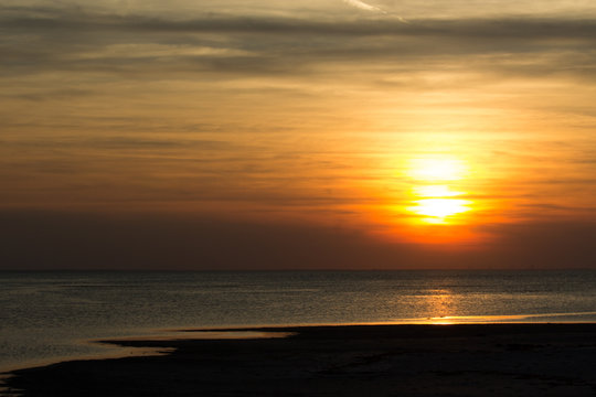 sunset over the sea © Tomtsya