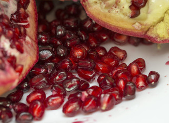 tasty pomegranate on a white plate