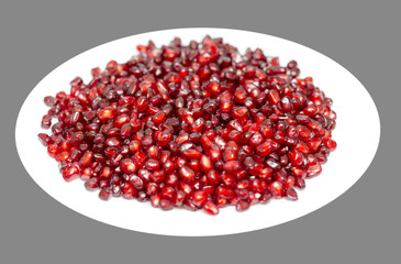 tasty pomegranate on a white plate