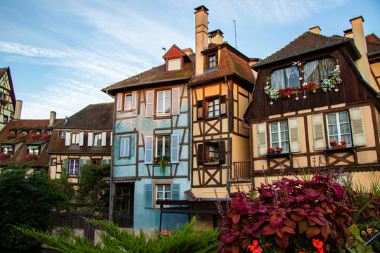Sunrise in the old town of Colmar, Alsace, France on a sunny day. Small street and traditional half timbered houses.  Also known as  Petit Venice.