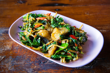 Fried spicy fish with many herbs. recommended local menu for tourist and traveler. food with hot and spicy herb. image for background, objects, menu list.  fire Catfish Spicy.
