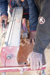 Cutting porcelain tiles using a diamond blade saw