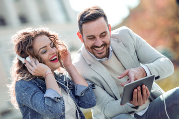 Couple listening music outdoor