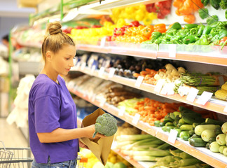 Woman buying vegetable at the market