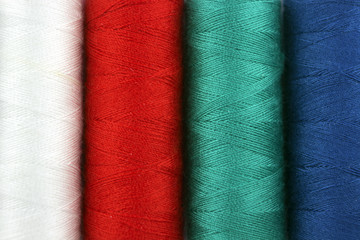 spools of colored threads, background