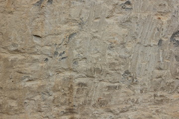Texture of a stone wall. Vintage background. A wall of medieval buildings. Abstract pattern with a natural material