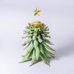 Christmas tree made of pineapple leaves. Holiday  minimal concept.