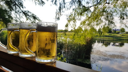 Serving cold draft beer over the lake