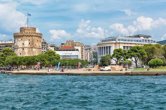 Thessaloniki, Greece - August 16, 2018: The National Theatre of Northern Greece & Aristotle's Theatre Building and White Tower in Thessaloniki.