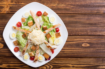 Salad ceasar with chicken , eggs and tomatoes
