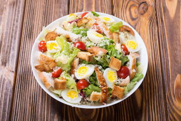 Salad ceasar with chicken , eggs and tomatoes