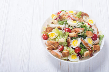 Salad ceasar with chicken , eggs and tomatoes