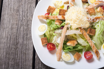 Salad ceasar with chicken , eggs and tomatoes