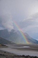 Rainbow over turnagain arm during low tide. 