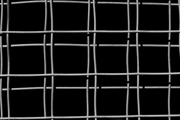old square metal mesh on a black background