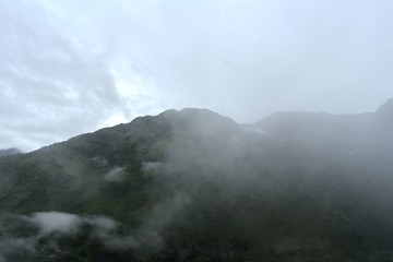 Fototapeta na wymiar lush green mountains with clouds