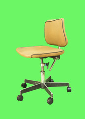 Old computer chair isolated on a green background