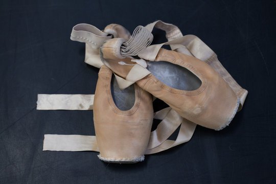 Old Ballet Shoes On The Studio Floor