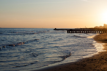 Beach at dawn, piers perspective view