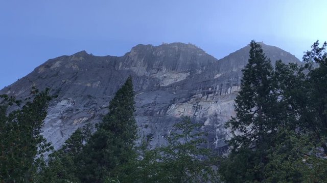 A daytime panoramic exterior establishing shot of Yosemite National Park.  	