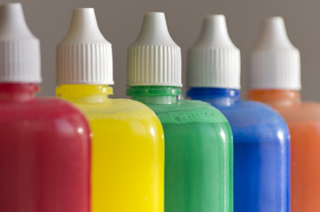 watercolors in small plastic bottles