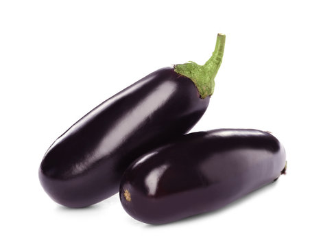 Tasty raw ripe eggplants on white background