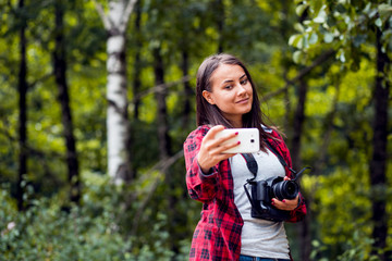 Young female photographer with dslr camera