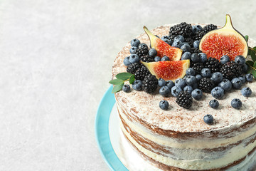 Delicious homemade cake with fresh berries on table, closeup