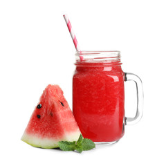 Tasty summer watermelon drink in mason jar and slice of fresh fruit on white background