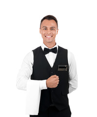 Portrait of young waiter in uniform on white background