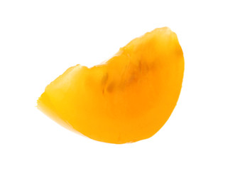 Slice of yellow tomato on white background