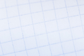 paper notepad in the background, macro