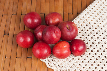 red plum on the wooden background
