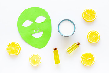 Cosmetics with natural ingredients. Facial mask, cream and lotion based on avocado and lemon essential oil on white background top view