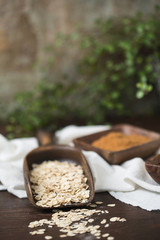 Raw Oatmeal in Wood Scoop; Coconut Brown Sugar and Mini Chocolate Chips in Wood Bowls; Wood Table