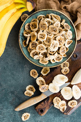 Dried banana chips and fresh bananas