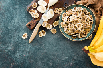 Dried banana chips and fresh bananas