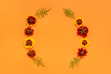 Yellow red flower frame on orange background