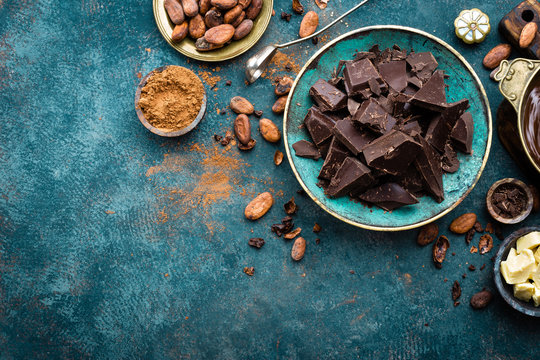 Chocolate. Dark bitter chocolate chunks, cacao butter, cocoa powder and cocoa beans. Chocolate background