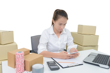 teenager owner business woman work at home with smartphone, laptop for online shopping writing the order