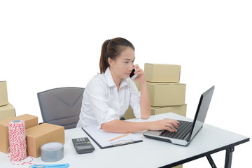 teenager owner business woman work at home with smartphone, laptop for online shopping writing the order