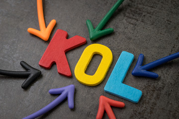 KOL abbreviation of Key Opinion Leader, influencer concept, colorful arrows pointing to the word...