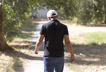 a man walking along the sidewalk