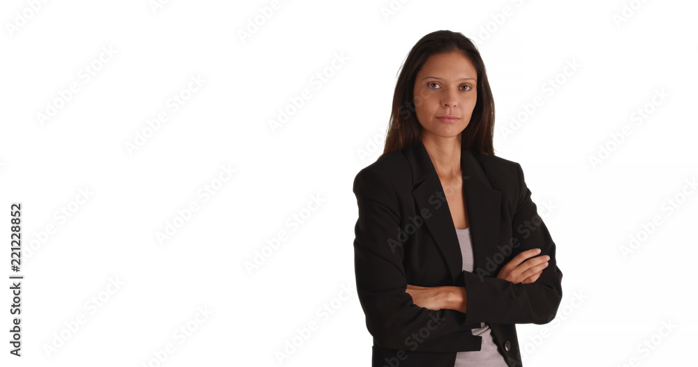 Wall mural Portrait of young professional crossing arms and looking at camera on white