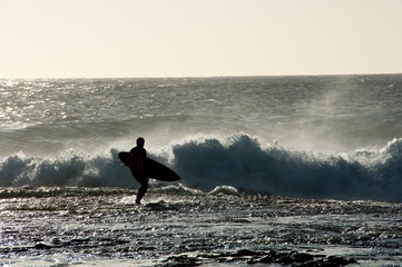 Surfer Silhouette in Ocean © Adwo