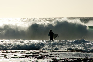 Surfer Silhouette in Ocean © Adwo