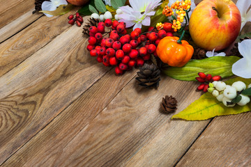 Fall decor with small pumpkin on wooden table, copy space