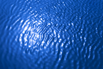 background of blue water in the sun